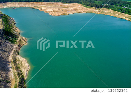 Aerial view of a large flooded sand quarry. Bolotsky quarry, Kaluga region, Russia Aerial view of a large flooded sand quarry. Bolotsky quarry, Kaluga region, Russia 139552542