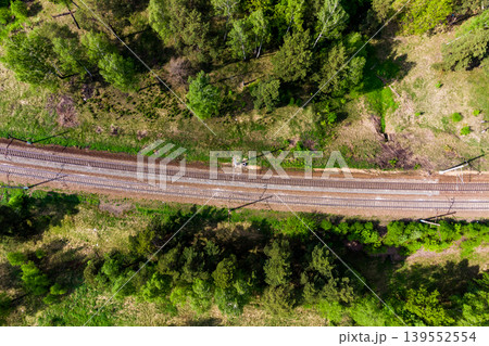 Top view of a railway with two tracks running among green nature Top view of a railway with two tracks running among green nature 139552554