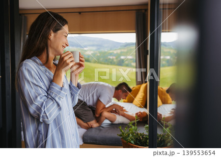 Family spending summer weekend away in cottage house in countryside. Family spending summer weekend away in cottage house in countryside. 139553654