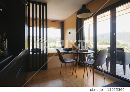 Cozy interior of compact container home or modular cabin. Cozy interior of compact container home or modular cabin. 139553664