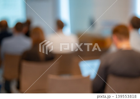 Blurred back view of people attending a business conference Blurred back view of people attending a business conference 139553818