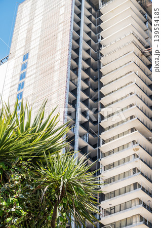 High-rise building under construction against a clear blue sky. 139554185