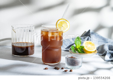 Cold Coffee Tonic Drink With Lemon and Ice 139554208