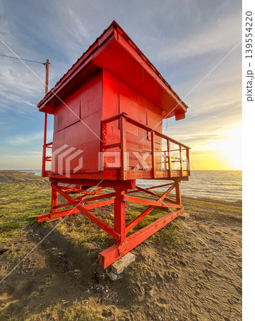 Red Lifeguard Tower on Beach at Sunset Red Lifeguard Tower on Beach at Sunset 139554220