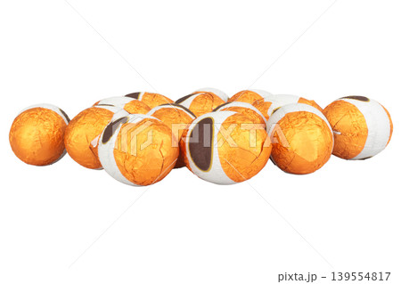 Chocolate balls wrapped in foil isolated on white background Chocolate balls wrapped in foil isolated on white background 139554817