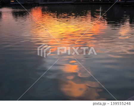 A stunning symphony of orange and gold painted across the evening sky. 139555248