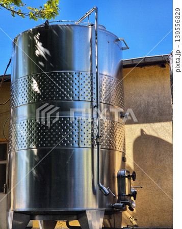 large stainless steel tanks for beverage production. metal tank for aging wine. large stainless steel tanks for beverage production. metal tank for aging wine. 139556829