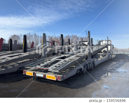 Car carrier parking. Several empty car carriers Car carrier parking. Several empty car carriers 139556896