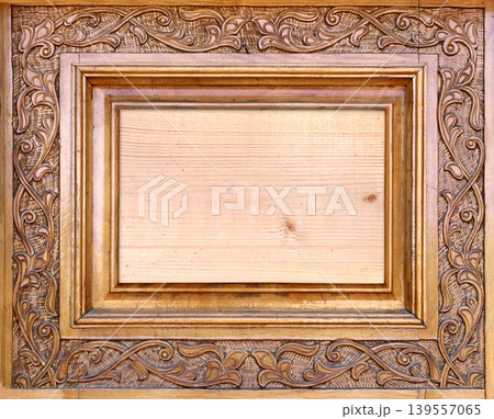 Wooden frame with islamic ornament. Antique wood backdrop with oriental ornaments. Traditional moroccan wood carving shutter with floral decor. Copy space for text Wooden frame with islamic ornament. Antique wood backdrop with oriental ornaments. Traditional moroccan wood carving shutter with floral decor. Copy space for text 139557065