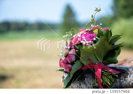 Bridal Bouquet with Roses in Sunlit Meadow 139557908
