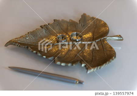 Wedding Rings on Decorative Metal Leaf Wedding Rings on Decorative Metal Leaf 139557974