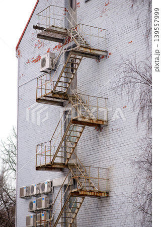 Rusty Metal Fire Escape On Brick Wall Rusty Metal Fire Escape On Brick Wall 139557999