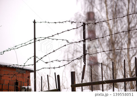 Barbed Wire Fence With Industrial Ruins 139558051