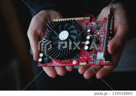 Graphics Card Held In Human Hands Graphics Card Held In Human Hands 139558065