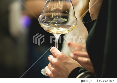 Elegant Wine Glass In Hand During Social Event Moment Elegant Wine Glass In Hand During Social Event Moment 139558107