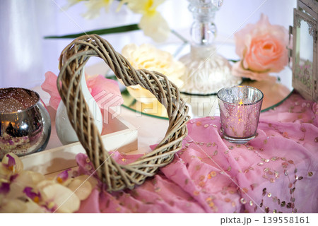 Romantic Decorative Table Setup With Soft Pink Tones Romantic Decorative Table Setup With Soft Pink Tones 139558161