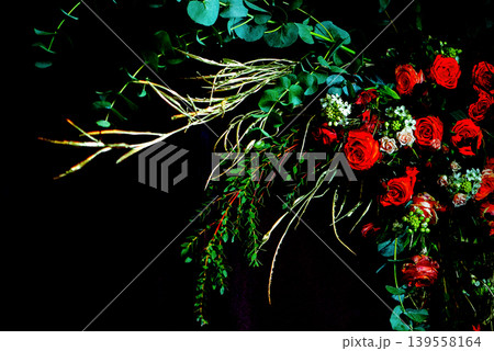 Dramatic Floral Arrangement With Red Roses And Dark Background 139558164