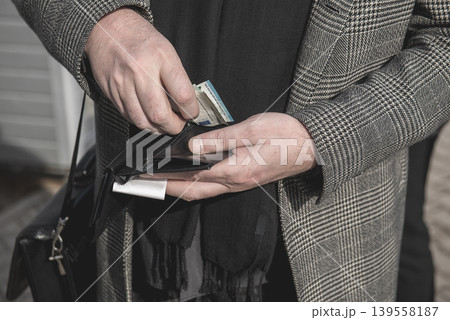 Middle Aged Man Taking Money From Wallet Closeup Middle Aged Man Taking Money From Wallet Closeup 139558187