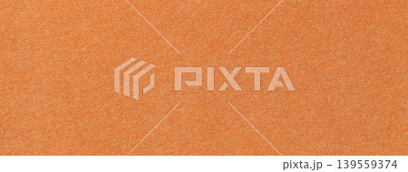 Orange suede fabric background with matte microfiber texture, soft apricot felt surface, macro Orange suede fabric background with matte microfiber texture, soft apricot felt surface, macro 139559374
