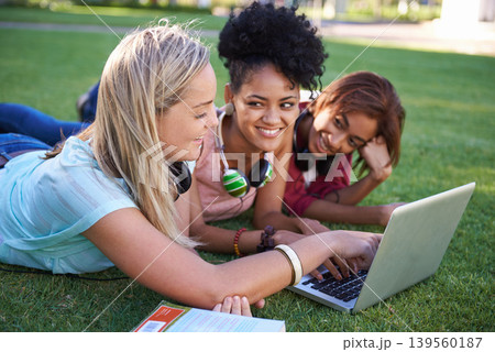 Grass, laptop or students in park at college, campus or together with online course, smile or group. University, relax or happy friends bond with support, teamwork or diversity in education on field 139560187