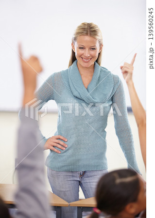 Hands in the air, woman and questions with students, teacher and knowledge in a classroom. School, educator and kids with answers, teaching and child development with a smile, learning and education Hands in the air, woman and questions with students, teacher and knowledge in a classroom. School, educator and kids with answers, teaching and child development with a smile, learning and education 139560245