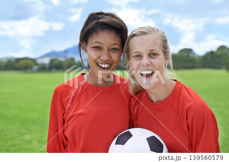 Girls, soccer players and portrait with ball, happiness and football field for match, competition or game. Fitness, practice and ready for training, outdoor and exercise for athlete, proud or sport 139560579