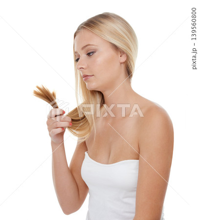 Woman, haircare and beauty for texture, treatment or salon on a white studio background. Female person, model or blonde looking at hair for damaged split ends, hairstyle or grooming on mockup space Woman, haircare and beauty for texture, treatment or salon on a white studio background. Female person, model or blonde looking at hair for damaged split ends, hairstyle or grooming on mockup space 139560800