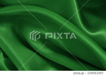 Dark green fabric cloth texture for background and design art work, beautiful crumpled pattern of silk or linen. 139561007