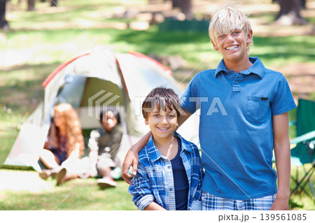 Boys, friends camping or portrait of happy kids in nature for playing, adventure or holiday vacation in park. Brothers, relax or male children with smile in woods, garden or forest for fun or travel Boys, friends camping or portrait of happy kids in nature for playing, adventure or holiday vacation in park. Brothers, relax or male children with smile in woods, garden or forest for fun or travel 139561085
