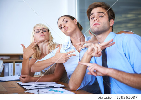Silly portrait, pose and business people with hand gesture for cool office environment, goofy workforce or picture. Facial expression, professional group and corporate team with gun symbol for photo Silly portrait, pose and business people with hand gesture for cool office environment, goofy workforce or picture. Facial expression, professional group and corporate team with gun symbol for photo 139561087