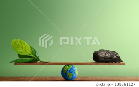 Balance scale with green leaf and coal, Carbon emission balance, environmental sustainability and climate change 139561127