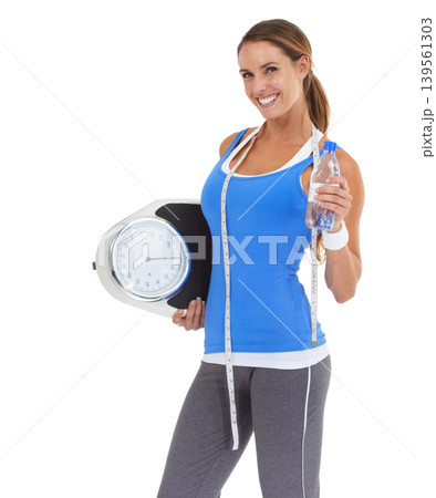 Woman, water bottle and scale in studio for health, diet and exercise, fitness or wellness results on a white background. Portrait of sports model with measure tape and liquid for training progress Woman, water bottle and scale in studio for health, diet and exercise, fitness or wellness results on a white background. Portrait of sports model with measure tape and liquid for training progress 139561303