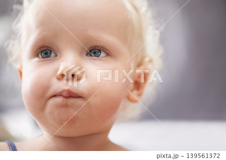 Thinking, baby and face of child in home alone, healthy and adorable in kindergarten or nursery. Dream, cute blonde toddler and young innocent kid, curious and serious facial expression in house Thinking, baby and face of child in home alone, healthy and adorable in kindergarten or nursery. Dream, cute blonde toddler and young innocent kid, curious and serious facial expression in house 139561372