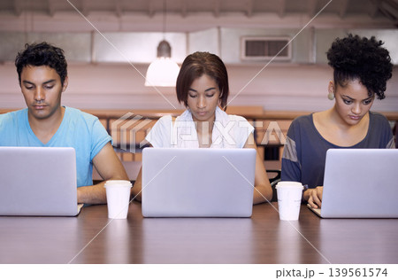University, typing and people in library on laptop for internet research, studying and online learning. Education, college and men and women with textbooks, computer and reading website for knowledge University, typing and people in library on laptop for internet research, studying and online learning. Education, college and men and women with textbooks, computer and reading website for knowledge 139561574