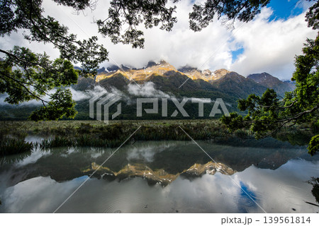 Reflection of Earl Mountains in Mirror Lakes along Milford Sound road, South Island, New Zealand. 139561814