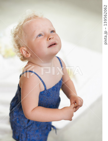 Sad, crying and girl baby at her home with unhappy, distress and naughty childhood personality. Problem, emotional and frustrated young kid, infant or toddler with development at modern house. Sad, crying and girl baby at her home with unhappy, distress and naughty childhood personality. Problem, emotional and frustrated young kid, infant or toddler with development at modern house. 139562062
