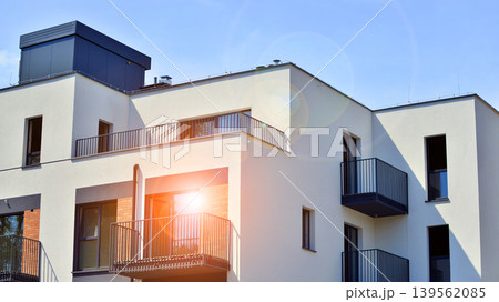 Contemporary apartment building in city. Residential building with balconies and modern facade. Contemporary apartment building in city. Residential building with balconies and modern facade. 139562085