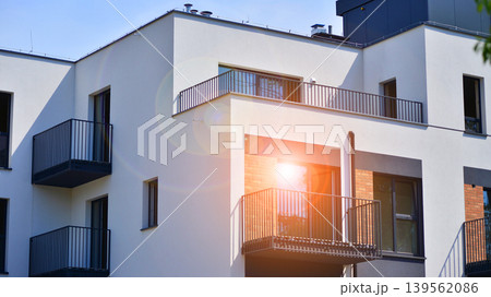 Contemporary apartment building in city. Residential building with balconies and modern facade. Contemporary apartment building in city. Residential building with balconies and modern facade. 139562086