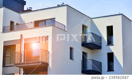 Contemporary apartment building in city. Residential building with balconies and modern facade. Contemporary apartment building in city. Residential building with balconies and modern facade. 139562087