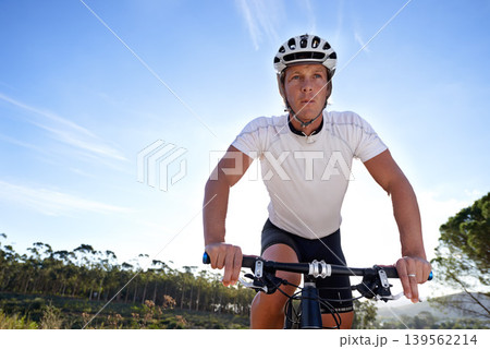Sky, race and man cycling in nature training for competition on trail in forest or woods. Mockup space, sports or fast cyclist athlete riding bicycle at speed for cardio exercise, fitness or workout Sky, race and man cycling in nature training for competition on trail in forest or woods. Mockup space, sports or fast cyclist athlete riding bicycle at speed for cardio exercise, fitness or workout 139562214