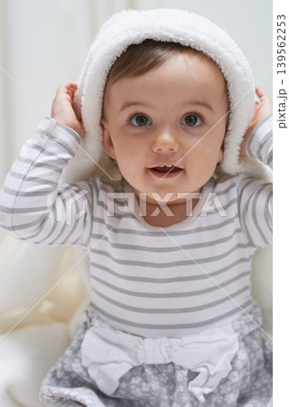 Cute, smile and portrait of baby with a blanket for playing, sitting and having fun at home. Happy, excited and face of sweet girl kid, child or toddler in a cute casual outfit in nursery at house. Cute, smile and portrait of baby with a blanket for playing, sitting and having fun at home. Happy, excited and face of sweet girl kid, child or toddler in a cute casual outfit in nursery at house. 139562253