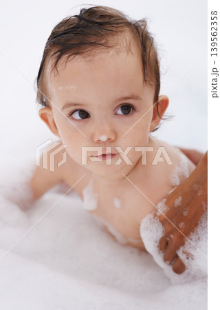 Baby, hygiene and foam soap for washing in bathroom, bath and cleaning for skincare at home. Girl, toddler and childcare or water for prevention of bacteria and virus, cosmetics and liquid for care Baby, hygiene and foam soap for washing in bathroom, bath and cleaning for skincare at home. Girl, toddler and childcare or water for prevention of bacteria and virus, cosmetics and liquid for care 139562358