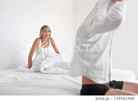 Man, undress and woman in bed for relax morning as couple for romance, connection or marriage. Male person, partner and shirt in apartment or rest together in home for happiness wife, laugh or casual Man, undress and woman in bed for relax morning as couple for romance, connection or marriage. Male person, partner and shirt in apartment or rest together in home for happiness wife, laugh or casual 139562400