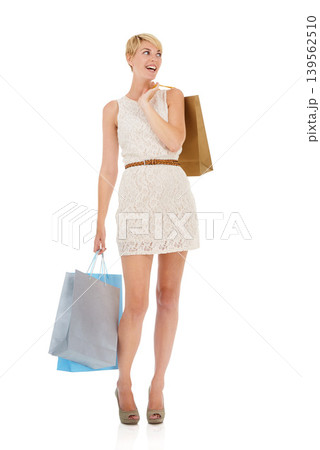 Happy woman, surprise and shopping bags in fashion, purchase or buying on a white studio background. Female person, shopper or blonde smile with gift bag for deal, discount or sale on mockup space 139562510