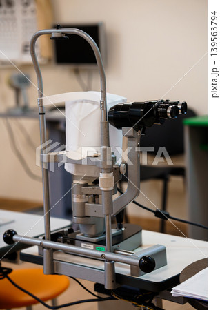 Ophthalmology Slit Lamp Microscope Examination Equipment In Clinic With White Background And Blue Accent 139563794