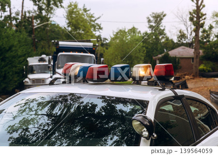 Police vehicle with lights on top parked near buildings during community event Police vehicle with lights on top parked near buildings during community event 139564059