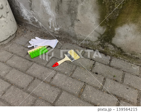Cleaning Tools and Paintbrush on Paving Stones 139564215