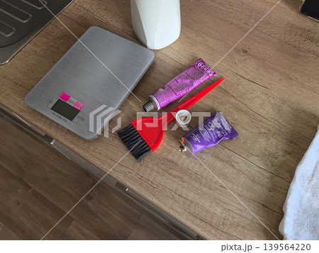 Professional Hair Dye Mixing Supplies on Wooden Counter Professional Hair Dye Mixing Supplies on Wooden Counter 139564220