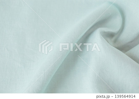 Light blue natural linen fabric, background texture, natural organic fabric. Light blue natural linen fabric, background texture, natural organic fabric. 139564914