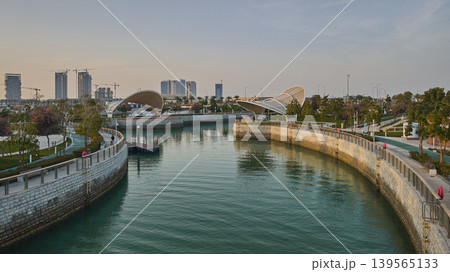 Qetaifan Island North, Lusail Qatar-February 12 2026: Majra Al Sail Park in Lusail offers canal views, lush gardens, kids' play areas, picnic zones, and walking trails along a 1.3 km saltwater canal. Qetaifan Island North, Lusail Qatar-February 12 2026: Majra Al Sail Park in Lusail offers canal views, lush gardens, kids' play areas, picnic zones, and walking trails along a 1.3 km saltwater canal. 139565133